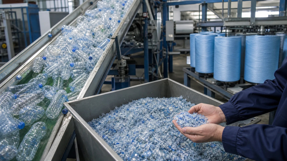 PET bottles flakes and blue recycled polyester yarn on an industrial recycling line