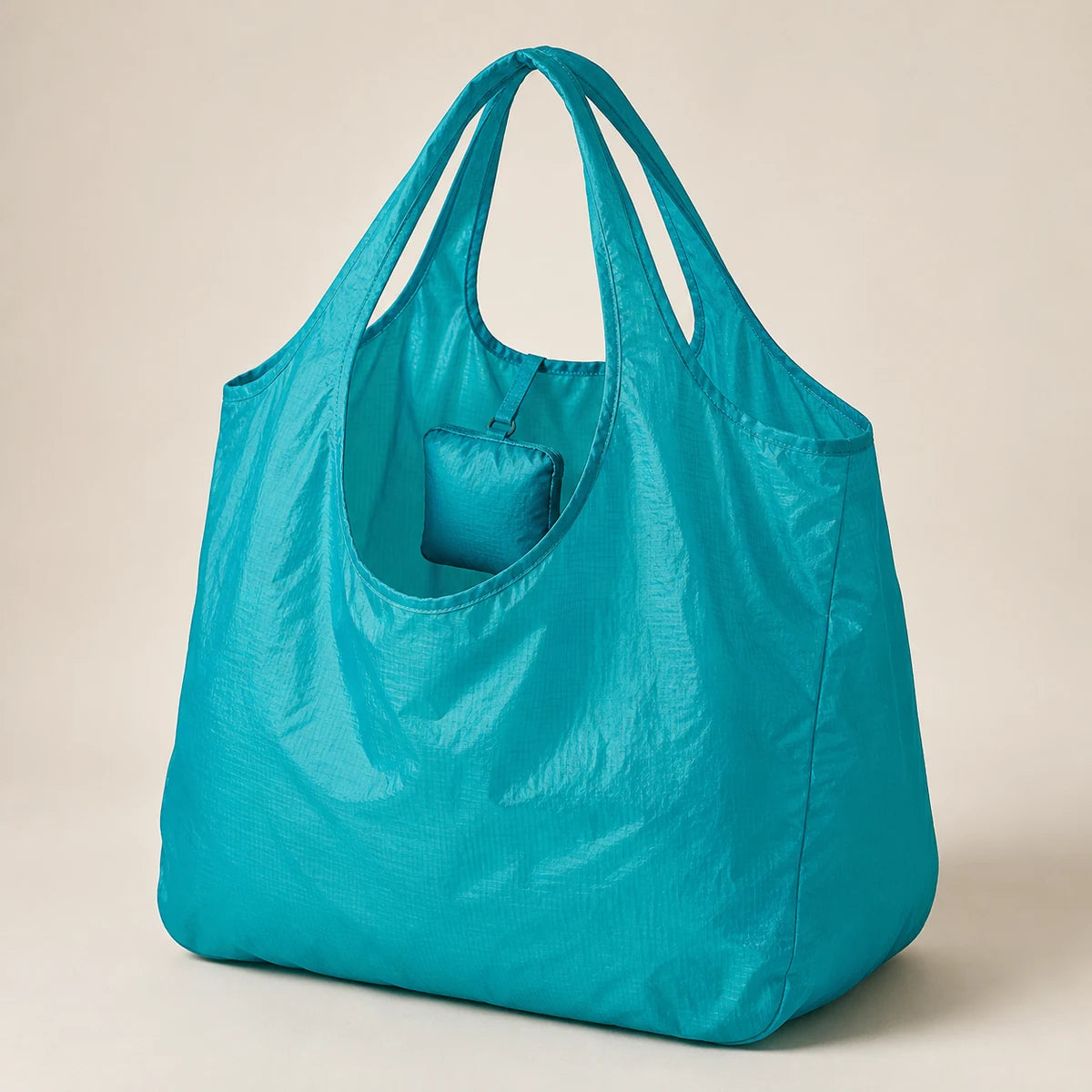 Bolsa de compras ripstop plegable teal con bolsa integrada y asas de lazo