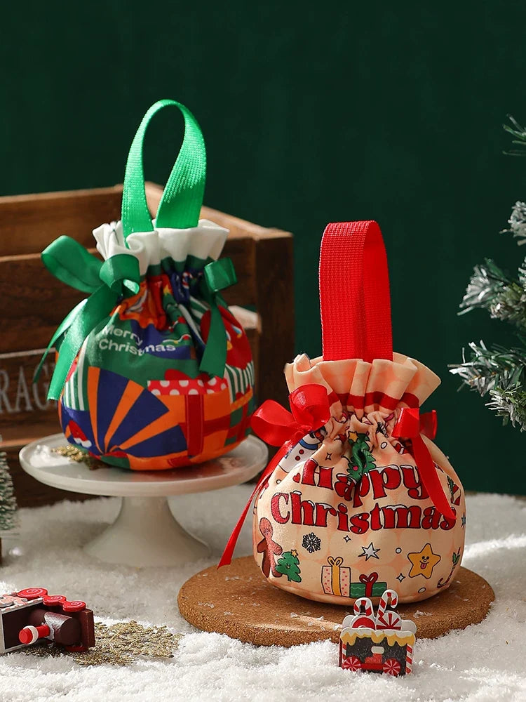 Two handled Christmas candy bags staged for a neighborhood gift-drop format decision