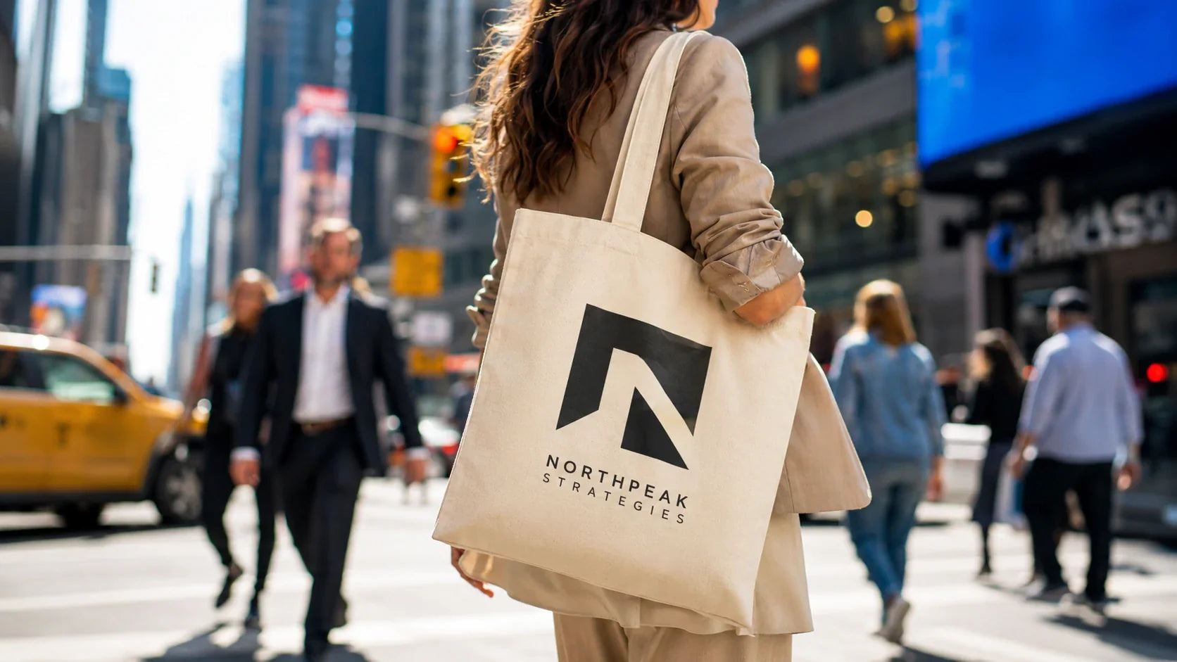 A stylish commuter carrying custom tote bags with logo, demonstrating maximum brand exposure on a busy city street.