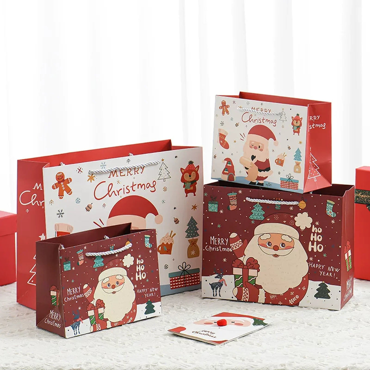 Rope-handle Christmas paper gift bags in multiple sizes prepared for a senior resident recipient-use trial