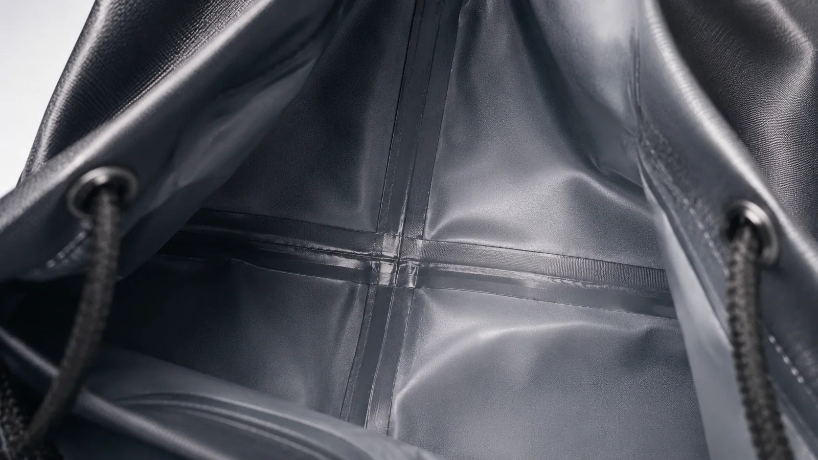 High quality waterproof drawstring bag repelling heavy rain droplets perfectly.