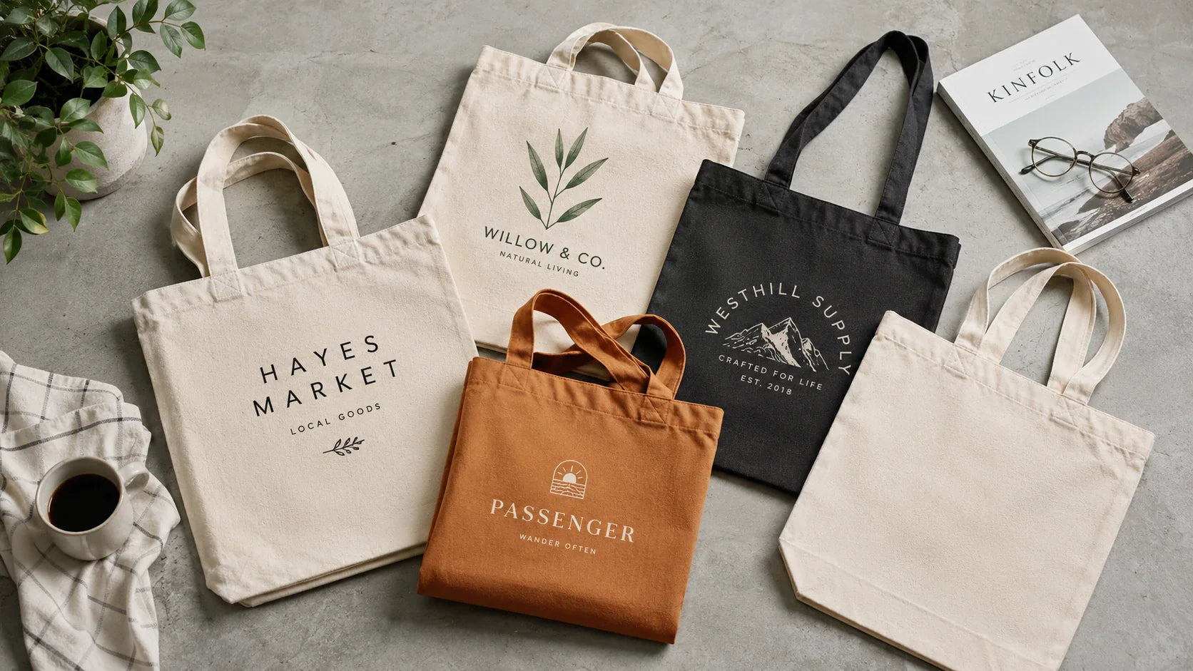 Different styles of Custom Printed Tote Bags on a wooden table