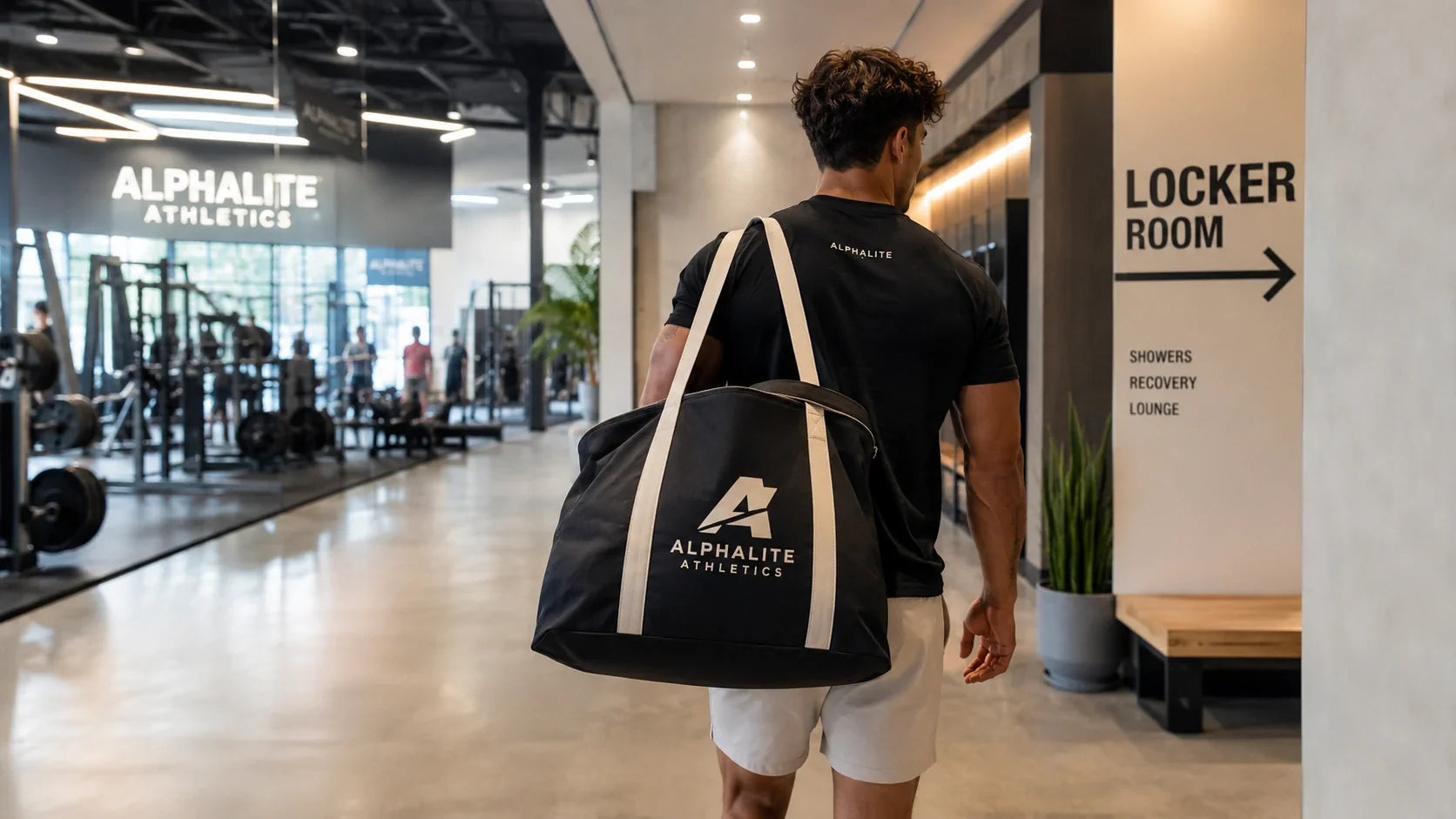 A gym member carrying a premium, heavy-duty custom canvas tote bag inside a modern fitness center.
