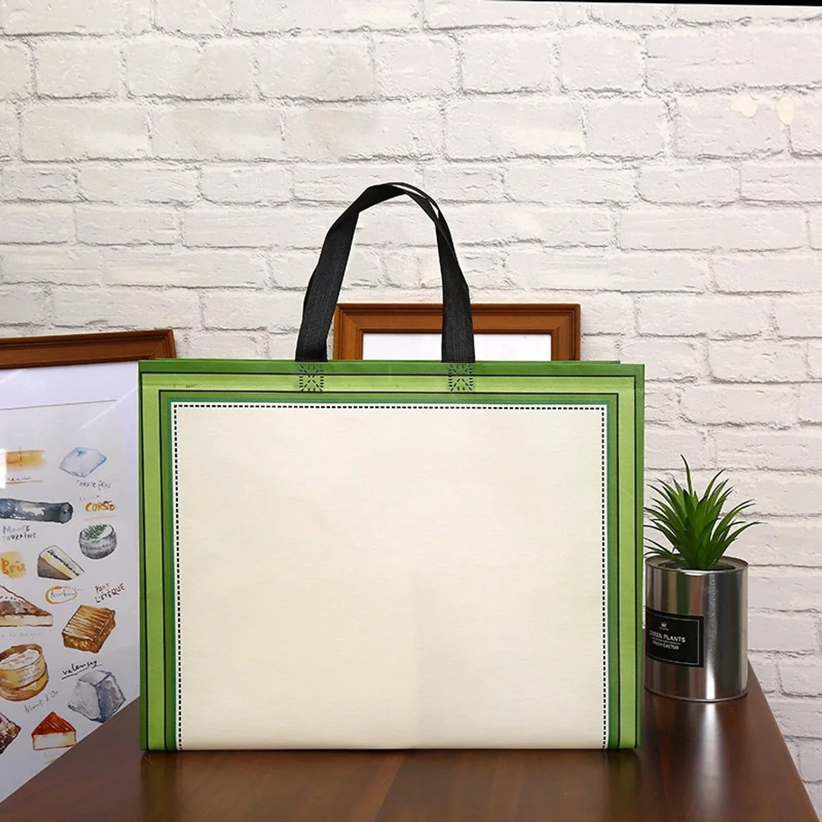 Green bordered non-woven conference tote with a pale central panel and black handles