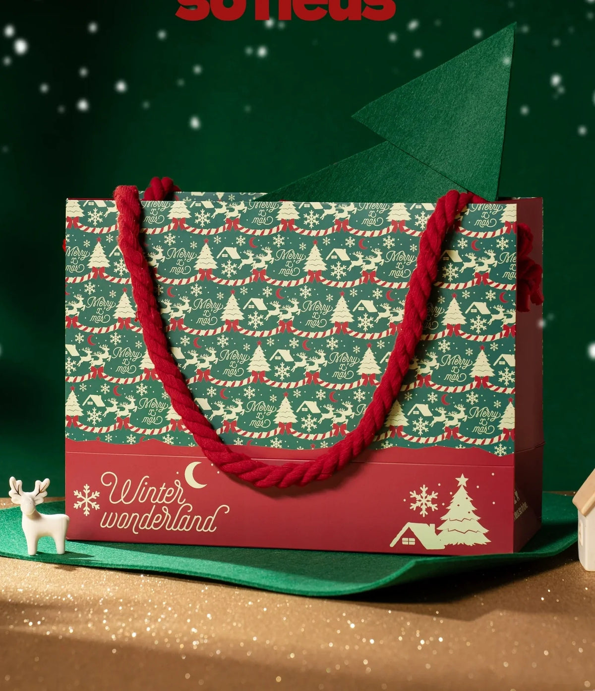 Printed red and green Christmas paper gift bag styled as the visual owner