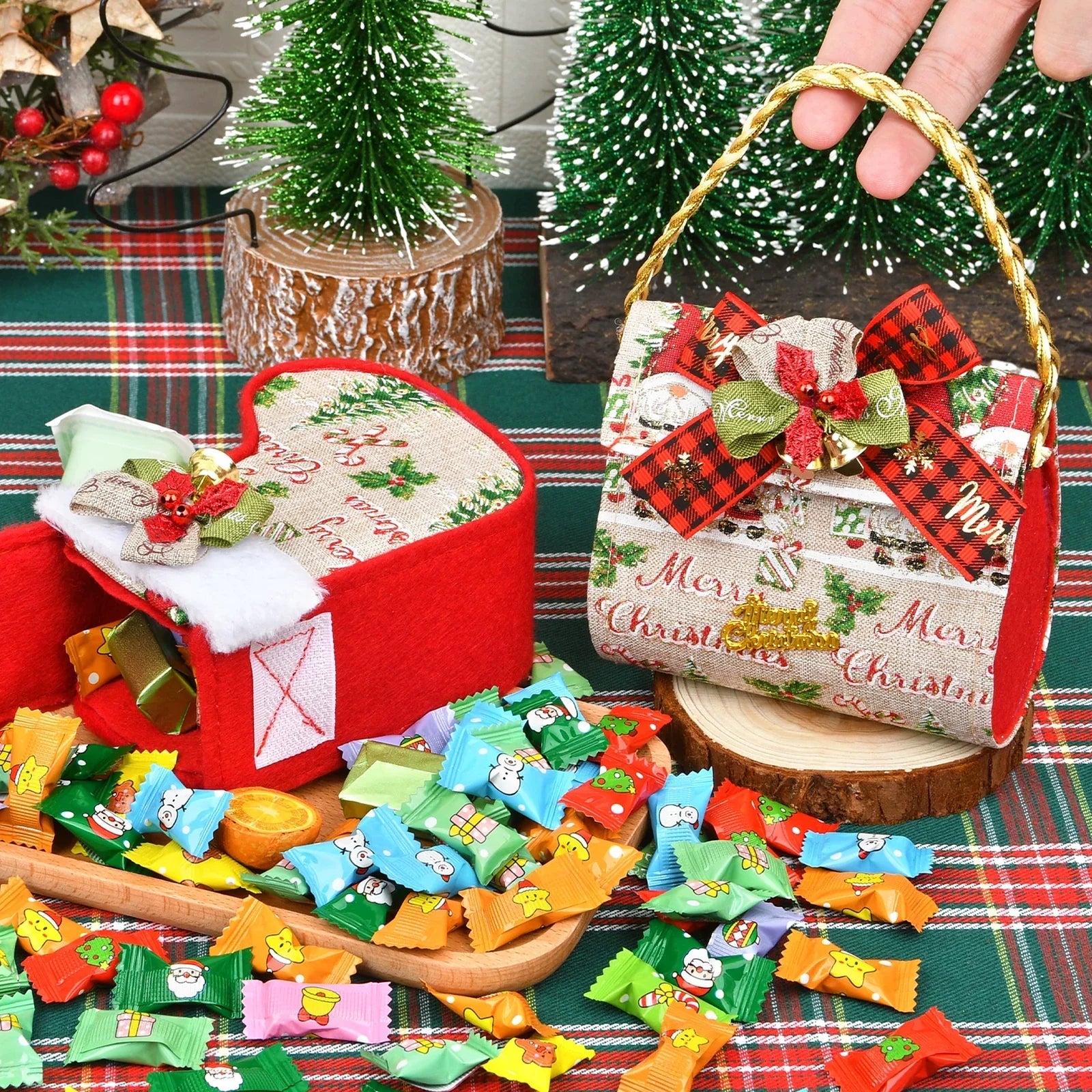 Open structured Christmas gift containers with rope handles displayed with individually wrapped sample items