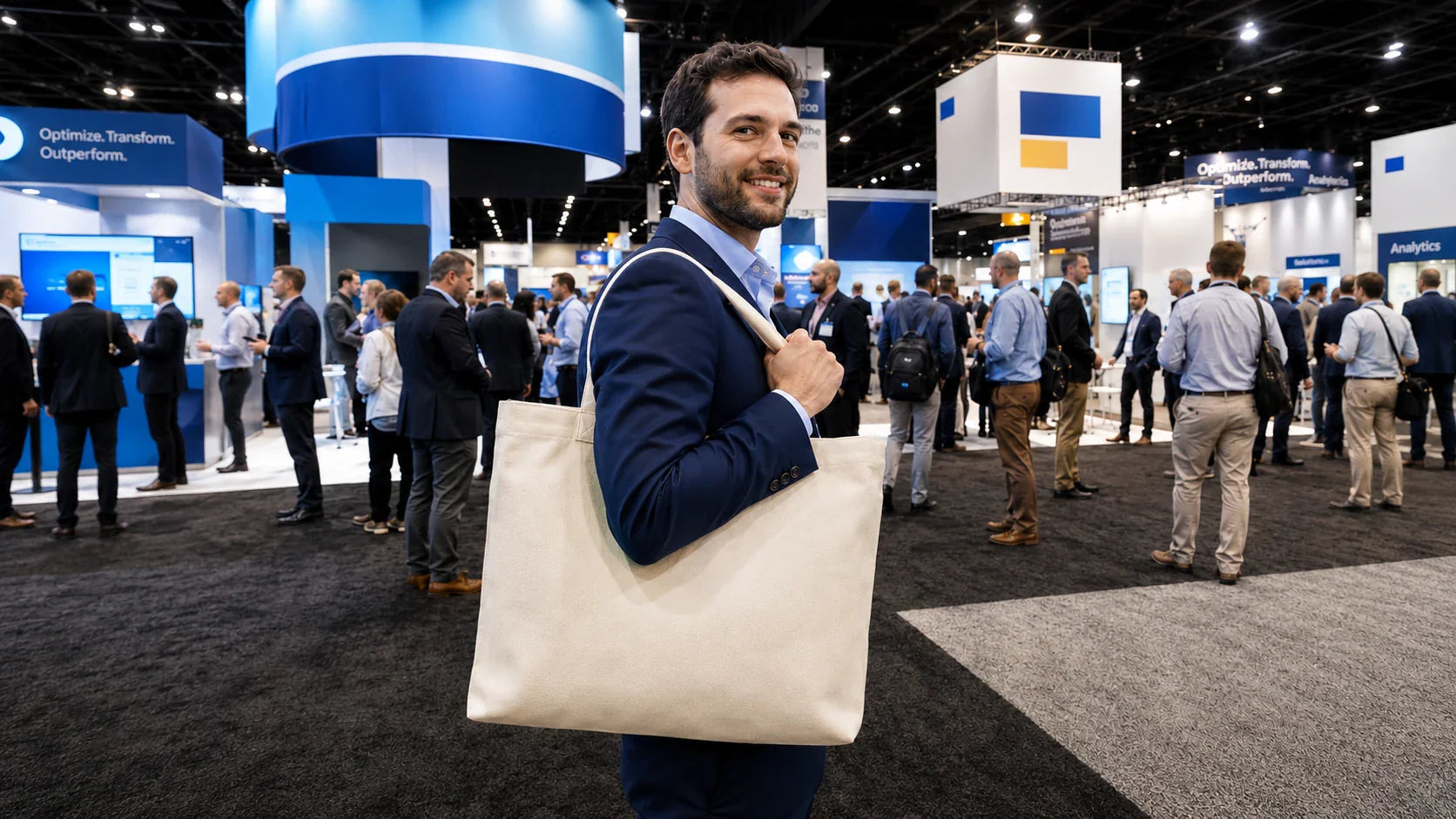 Professional businessman carrying premium Tote Bags Custom Logo at a busy corporate trade show.