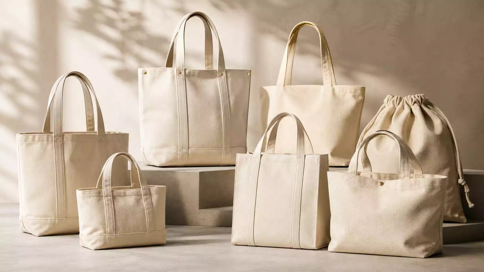 A premium collection of blank custom tote bags in various neutral colors and materials.
