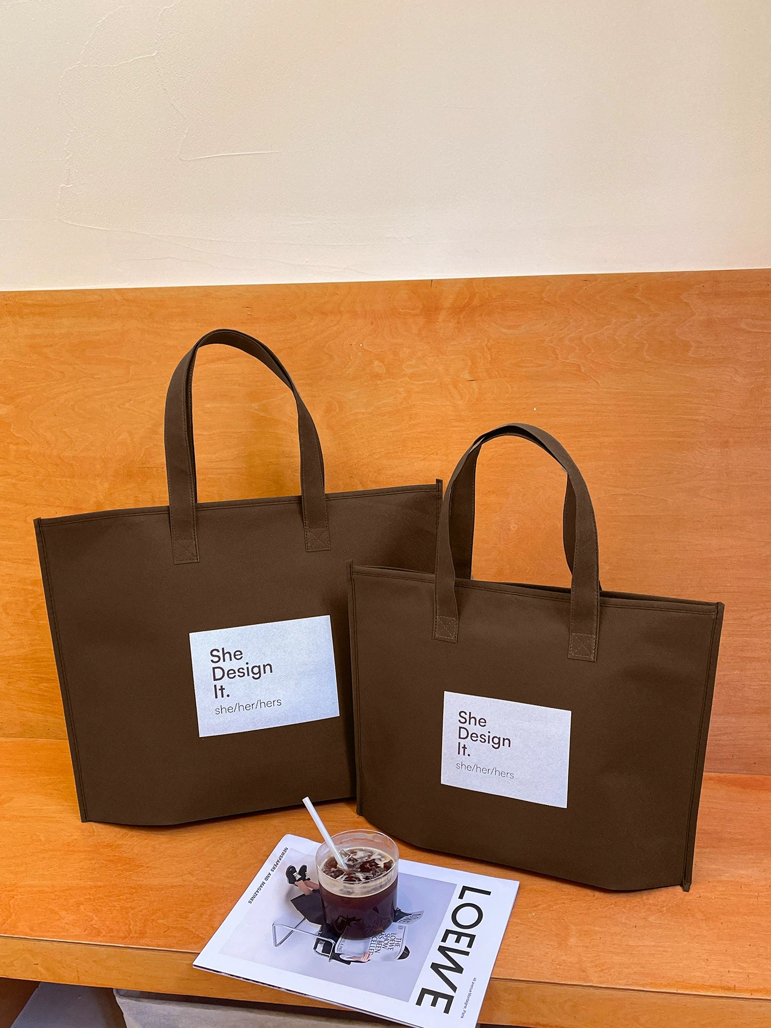 Brown SHE zippered non-woven tote bags in multiple sizes