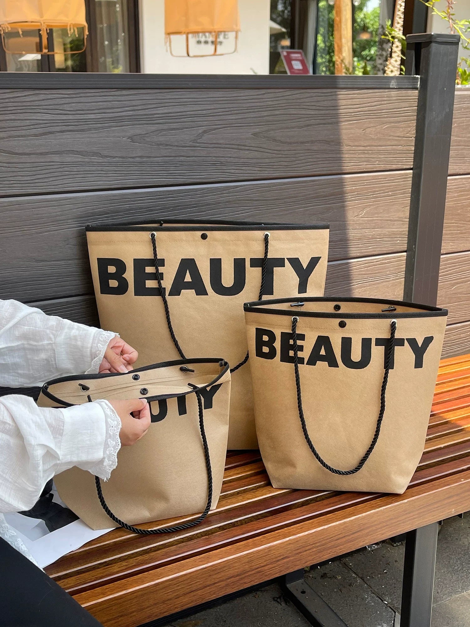 Brown trapezoid non-woven tote bags with rope handles
