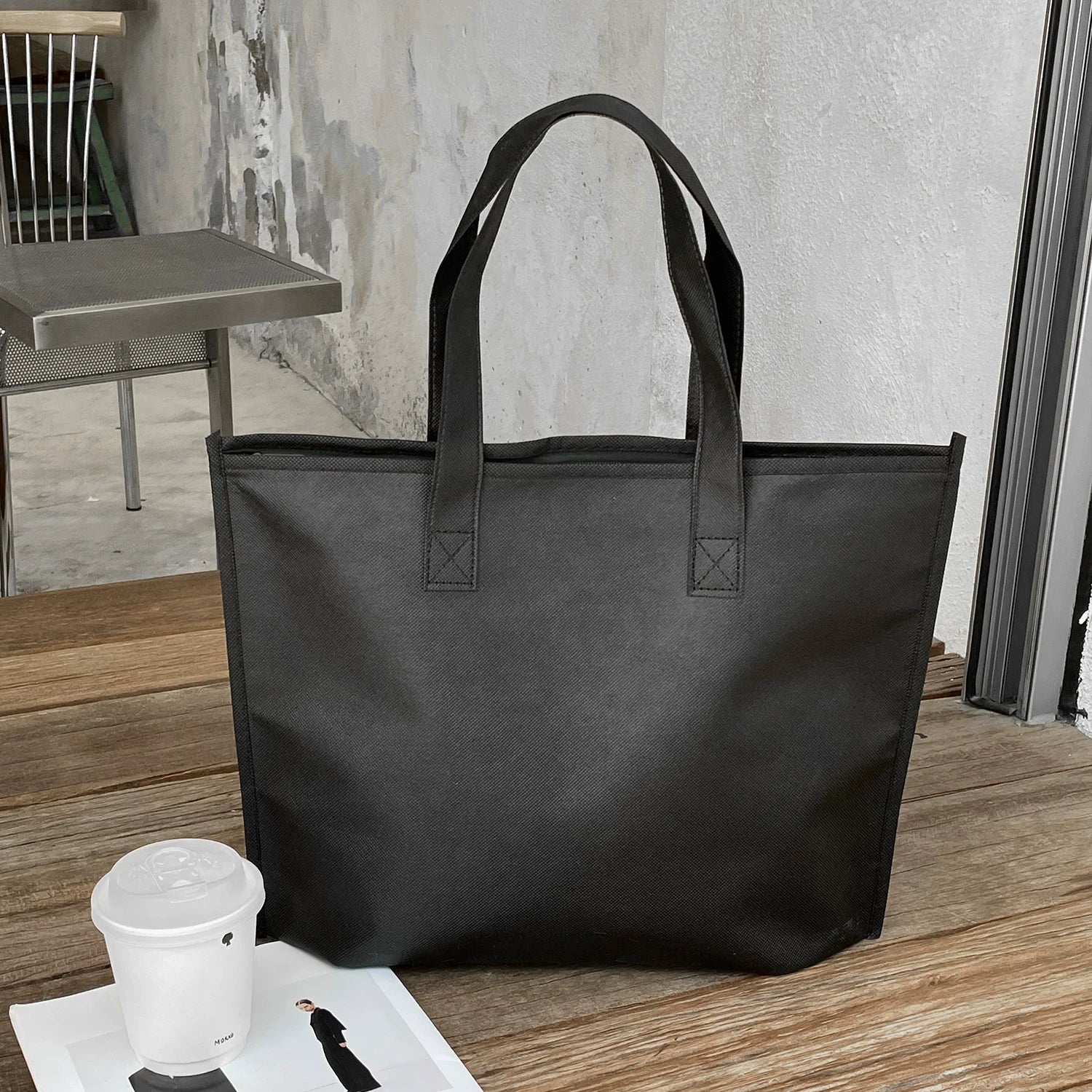 Plain black zippered non-woven tote bag