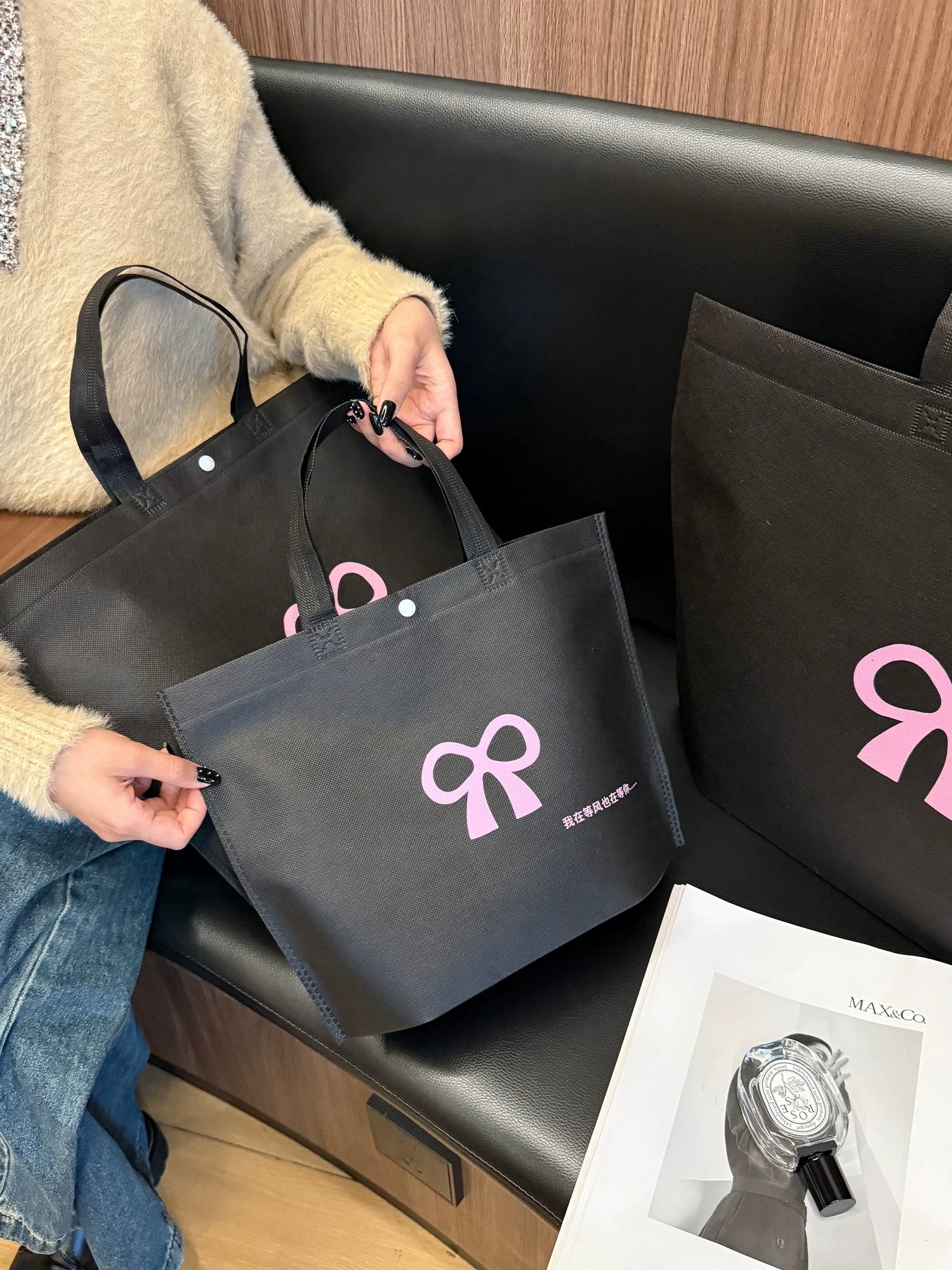 Large black bow non-woven tote bags in multiple sizes