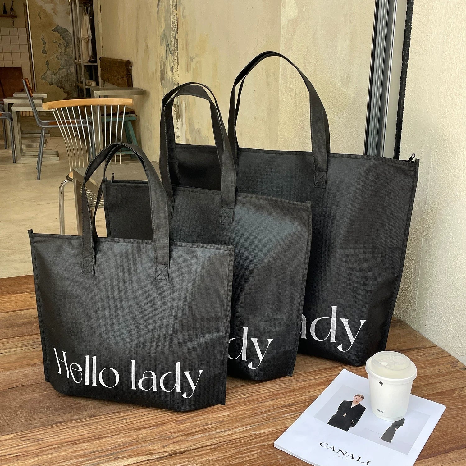 Black Hello-print zipper non-woven tote bag