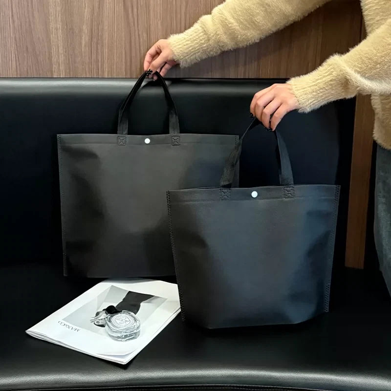 Plain black non-woven tote bag
