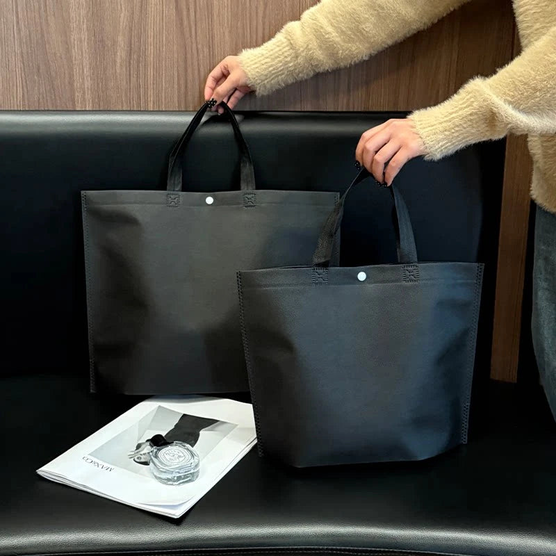 Plain black non-woven tote bag