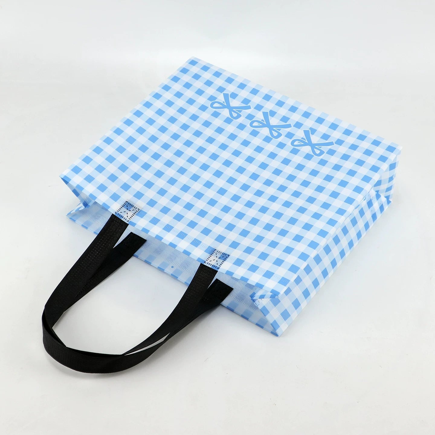 Blue plaid non-woven tote bag side and base view
