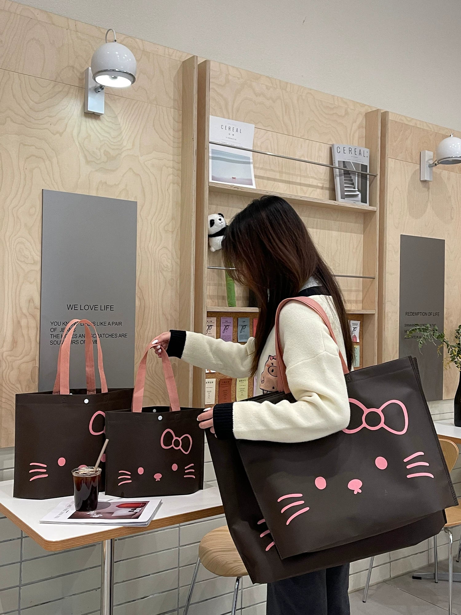Coffee brown bow-cat non-woven tote bag lifestyle view