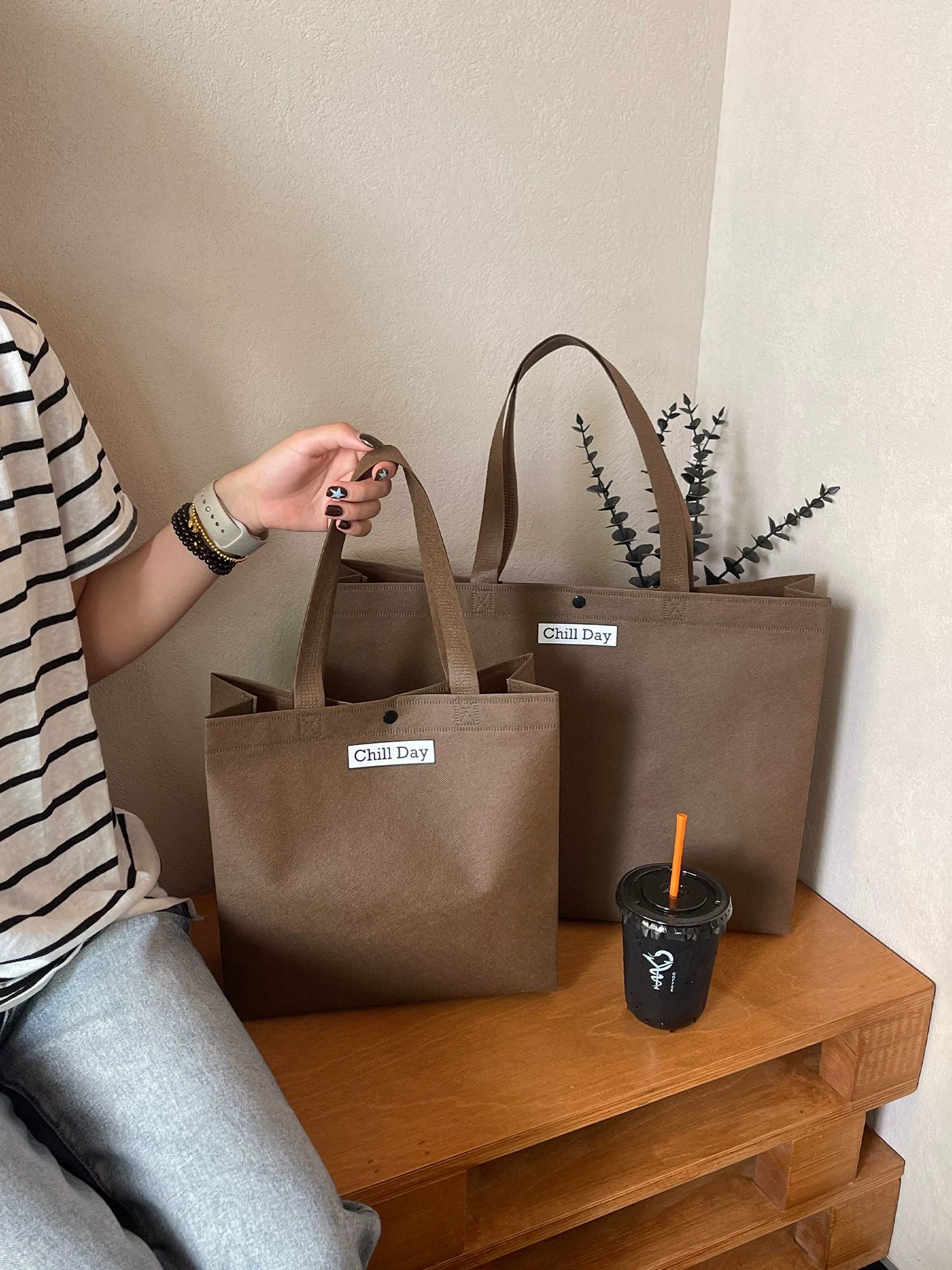 Brown structured non-woven tote bags in multiple sizes