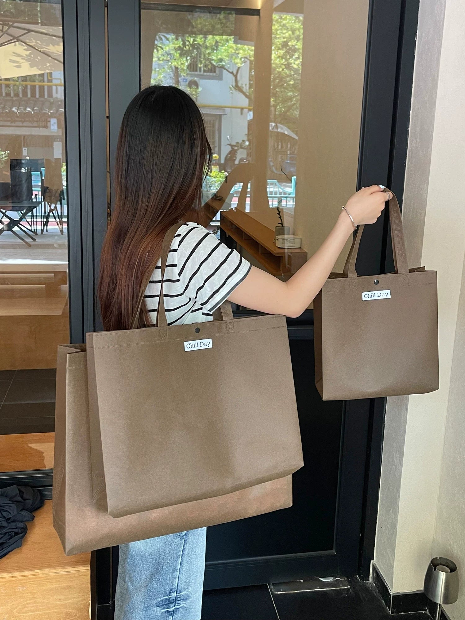 Brown structured non-woven tote bag for retail packaging