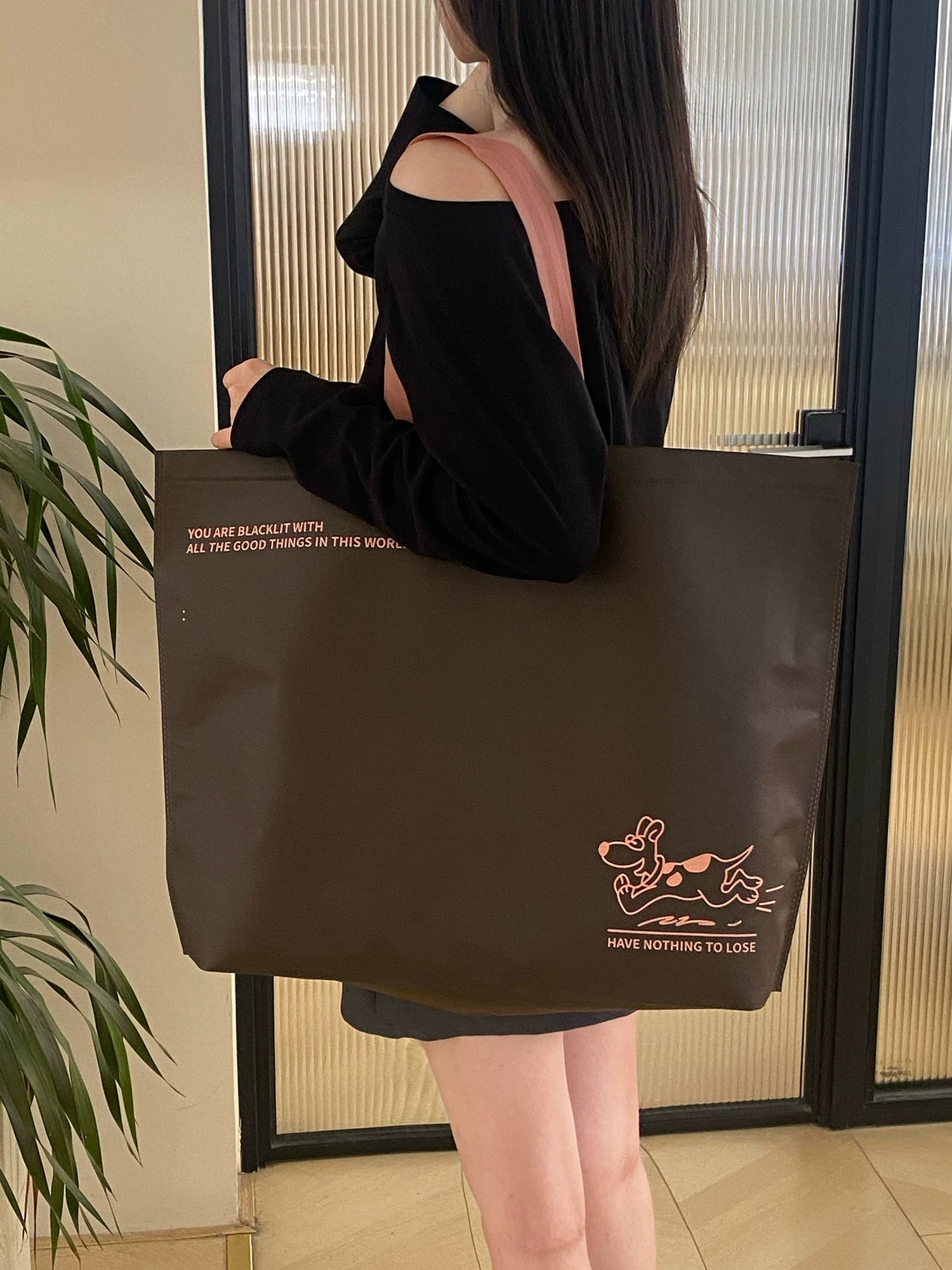 Coffee brown extra-thick non-woven tote bag in a lifestyle setting