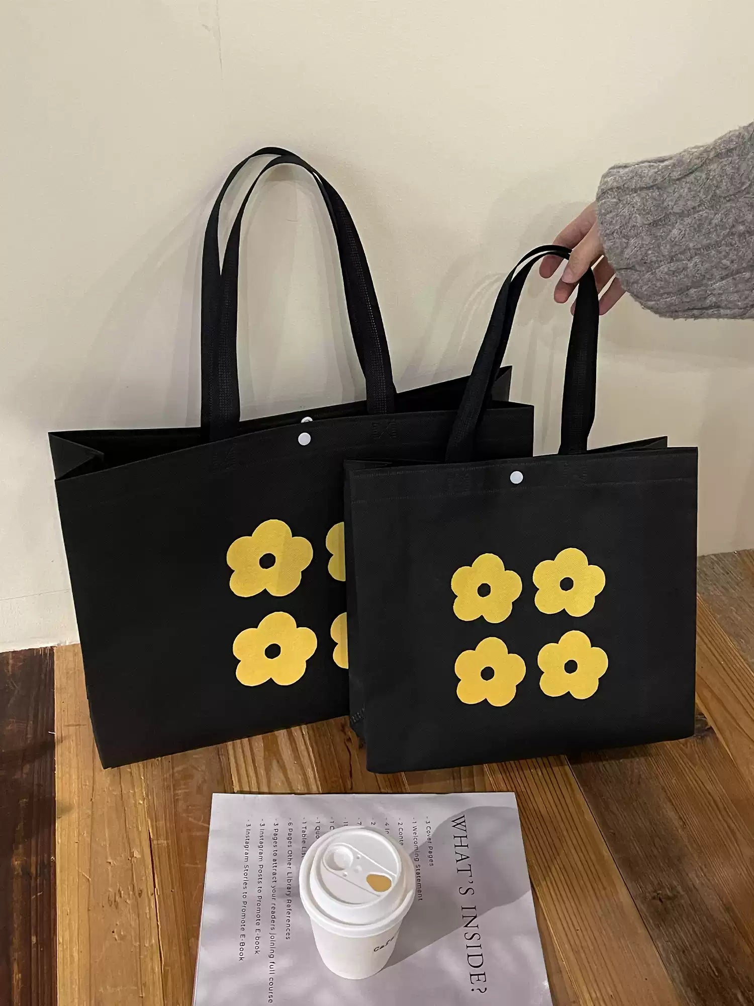Yellow flower non-woven tote bags shown in multiple sizes