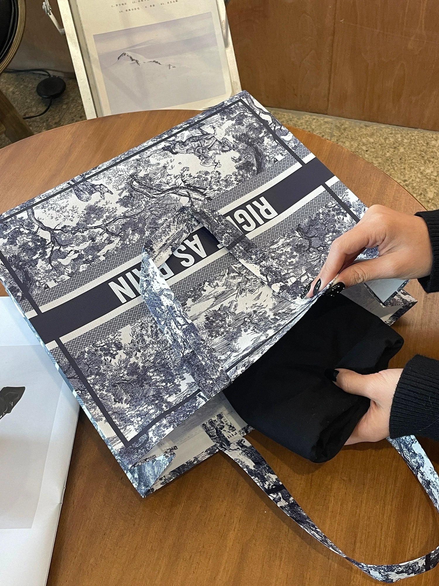 Foldable laminated non-woven tote bag showing flexible construction