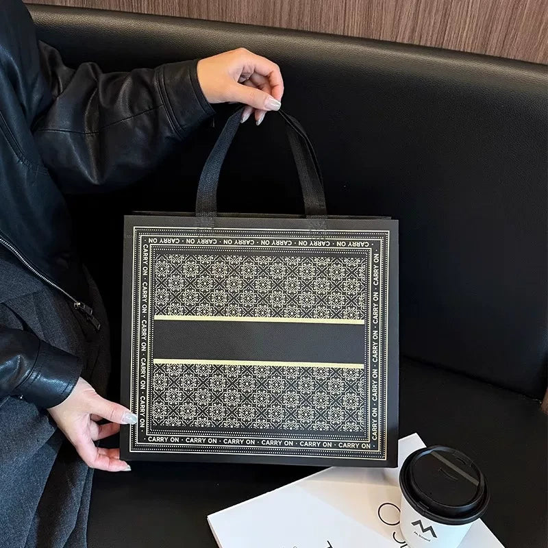LA black floral laminated non-woven tote bag with a blank center panel