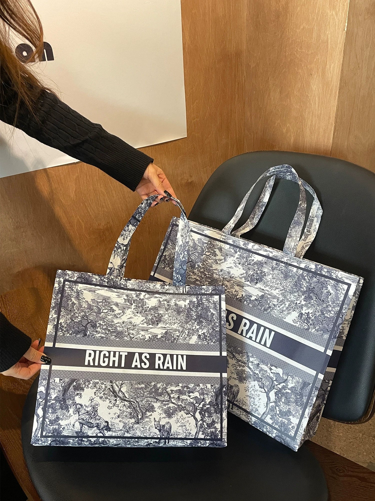 Laminated non-woven tote bags in medium and large sizes with a vintage toile print