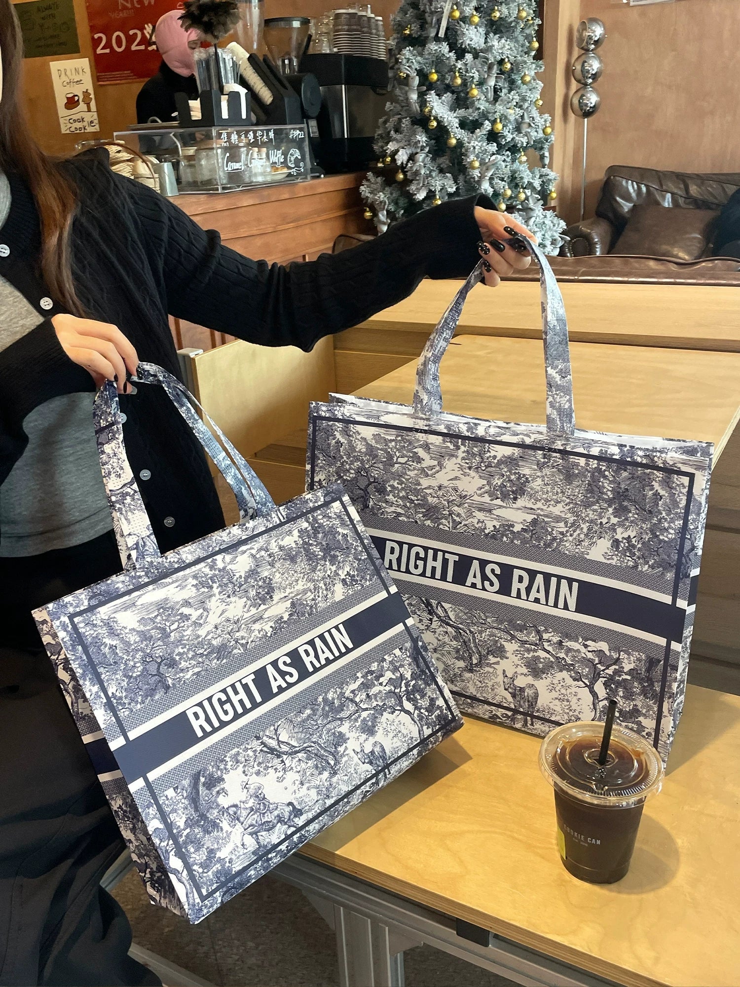 Medium and large laminated non-woven tote bags shown together