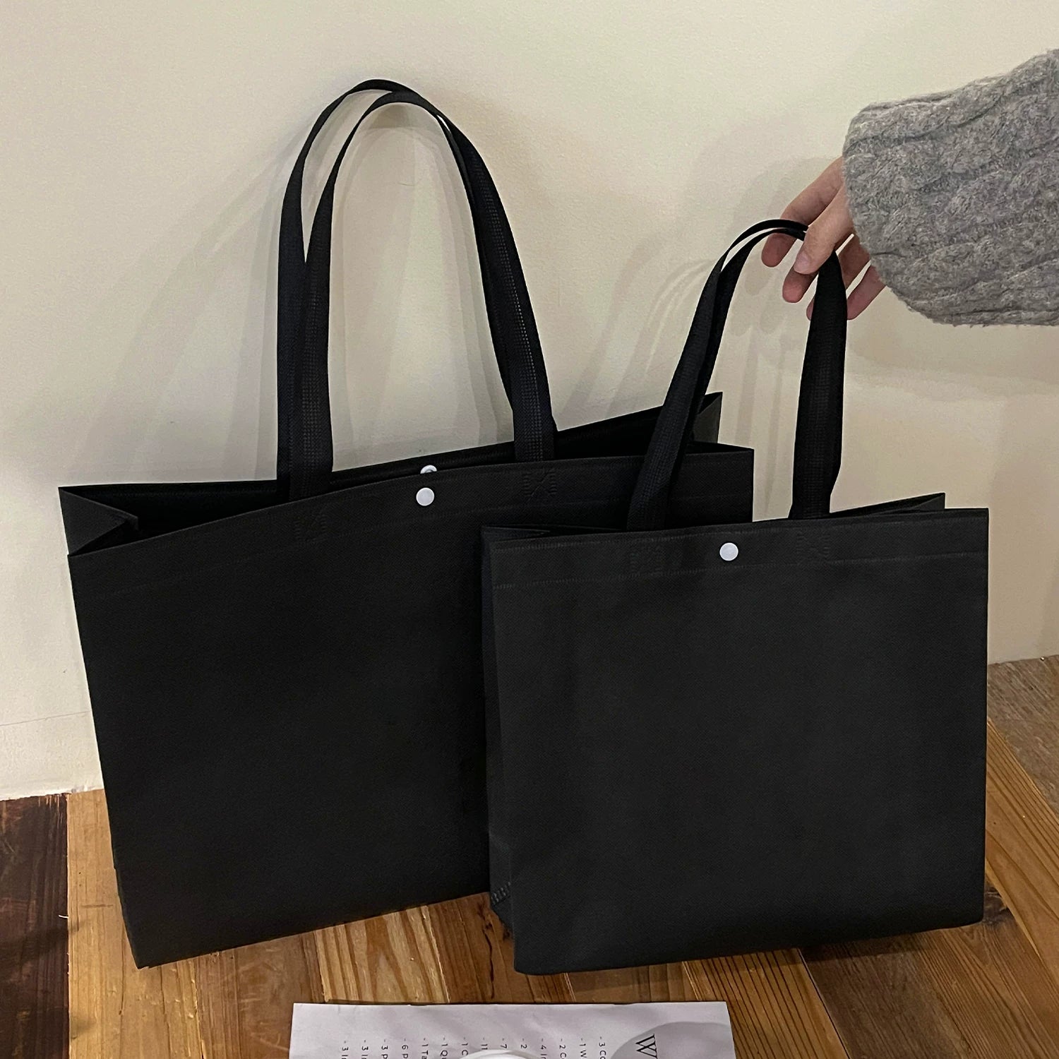 Plain black non-woven tote bag