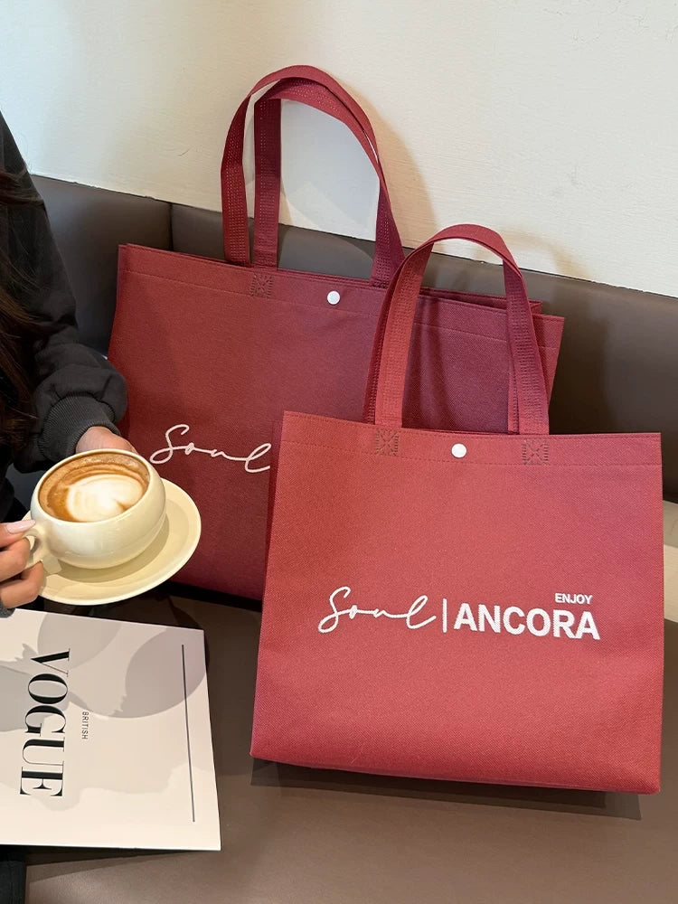 Red snap-button tote bags for apparel and gift packaging