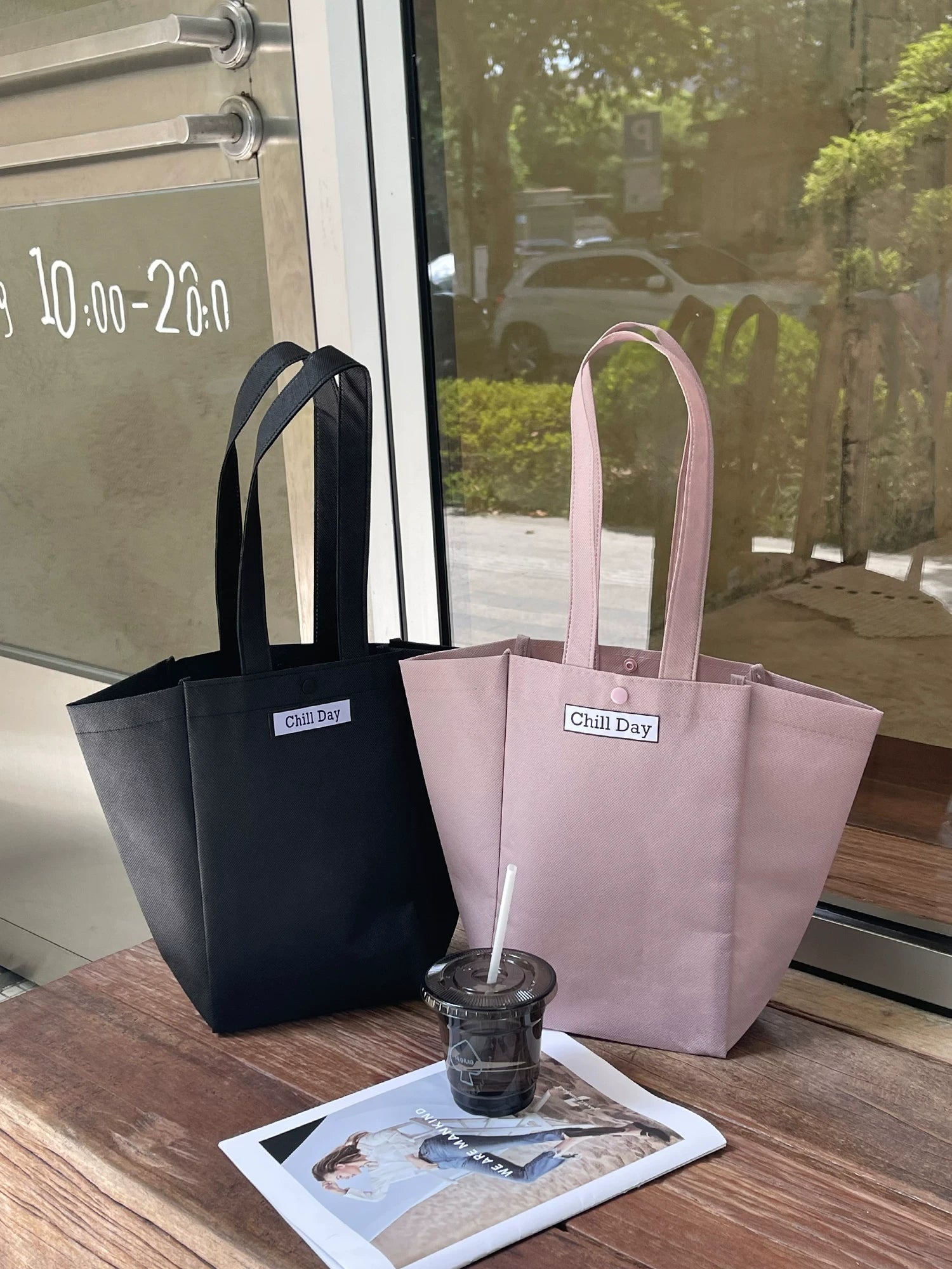 Black and light pink trapezoid non-woven tote bags for custom retail packaging