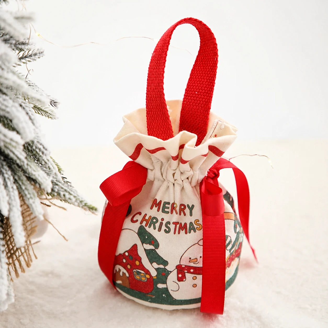 Drawstring Christmas fabric gift pouches with loop handles