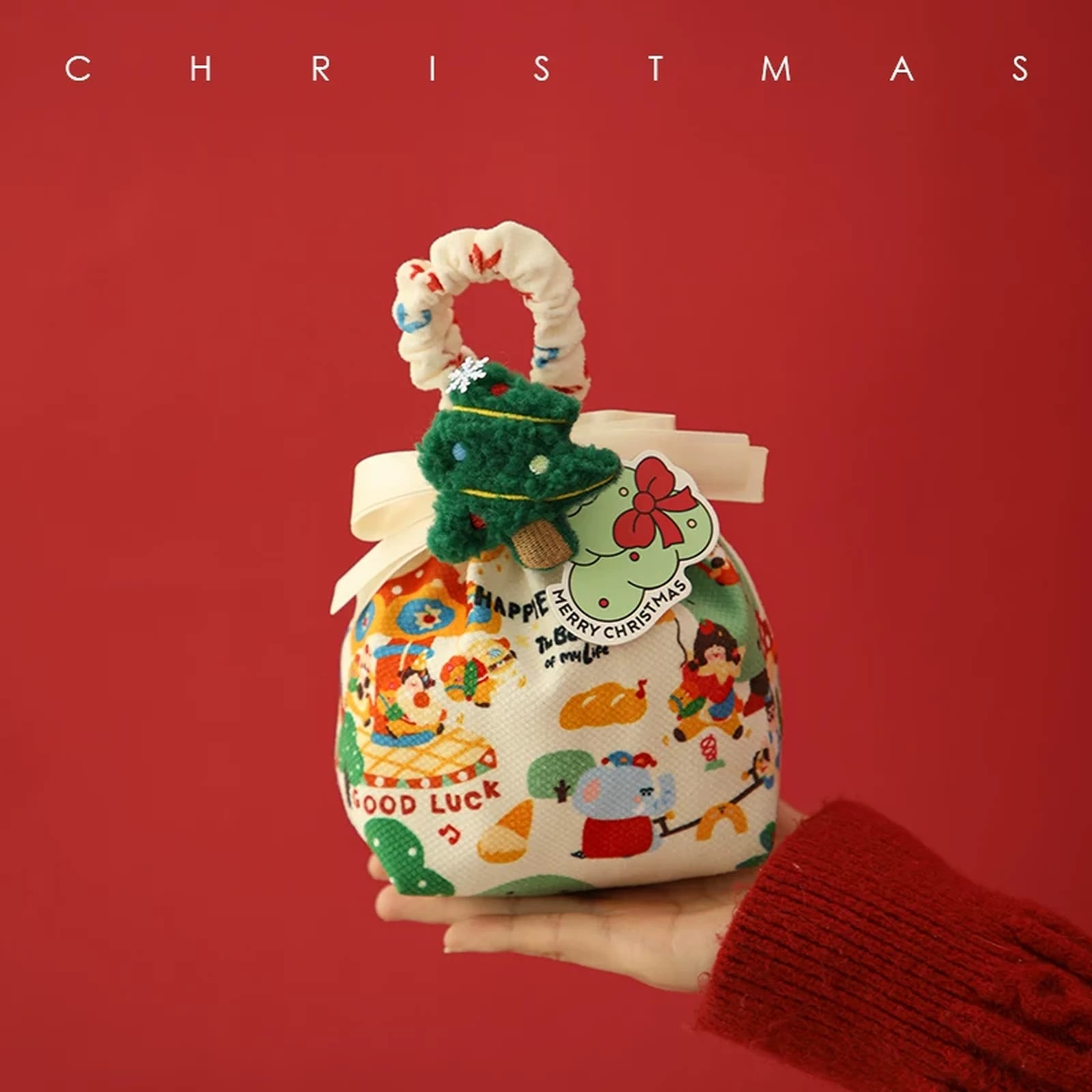 Drawstring Christmas fabric gift pouches with loop handles