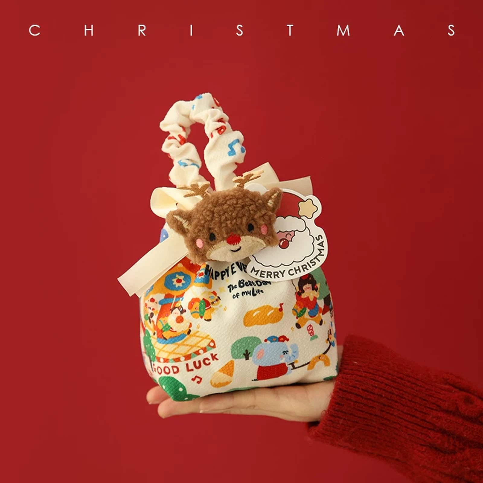 Drawstring Christmas fabric gift pouches with loop handles