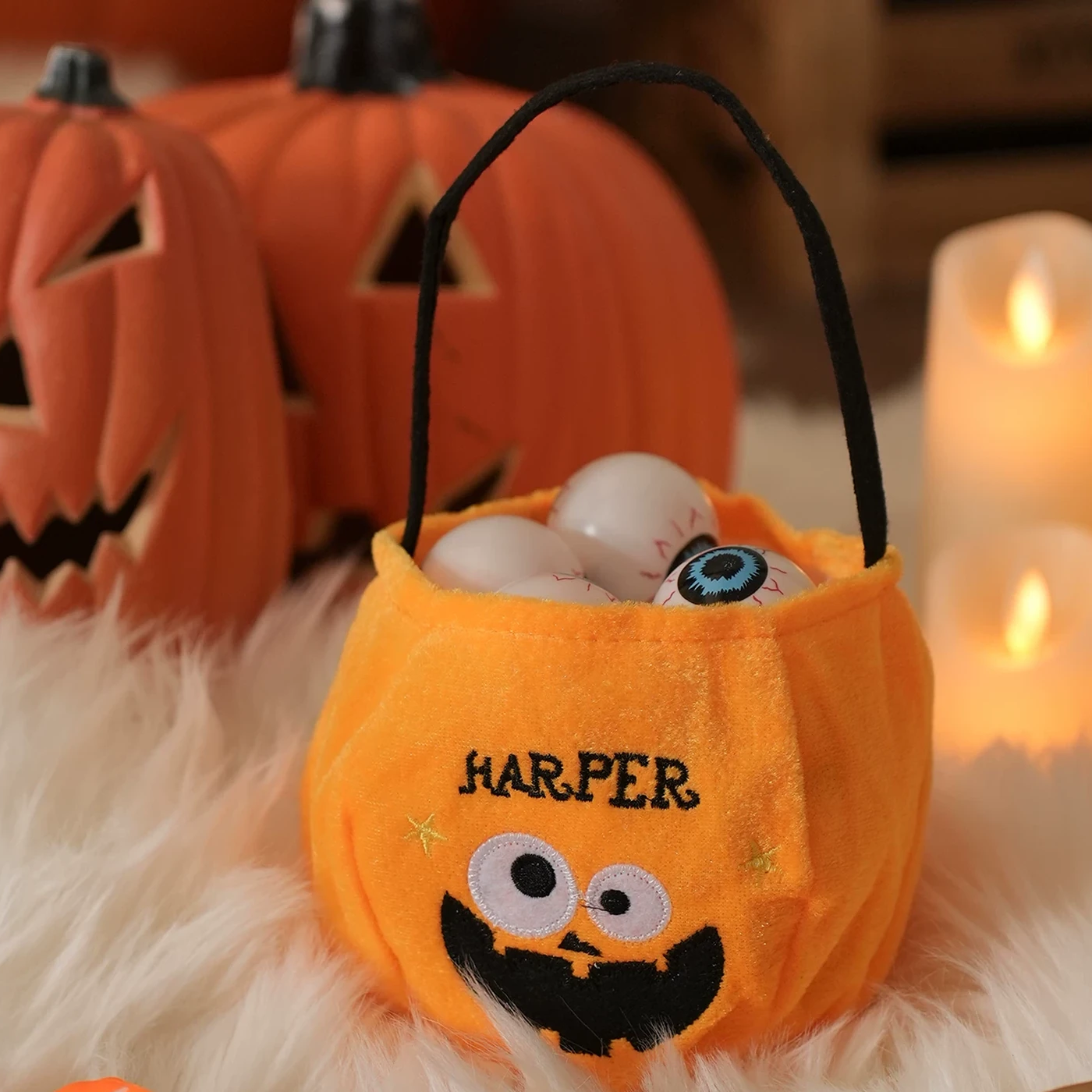 Orange monster face plush Halloween treat bag