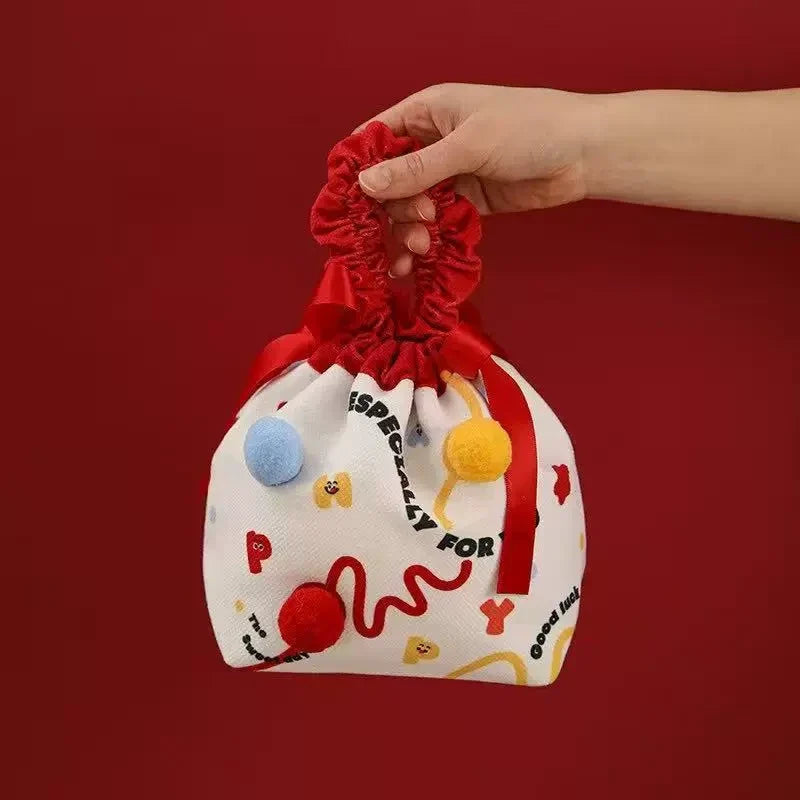 Red pom-pom fabric drawstring gift bag