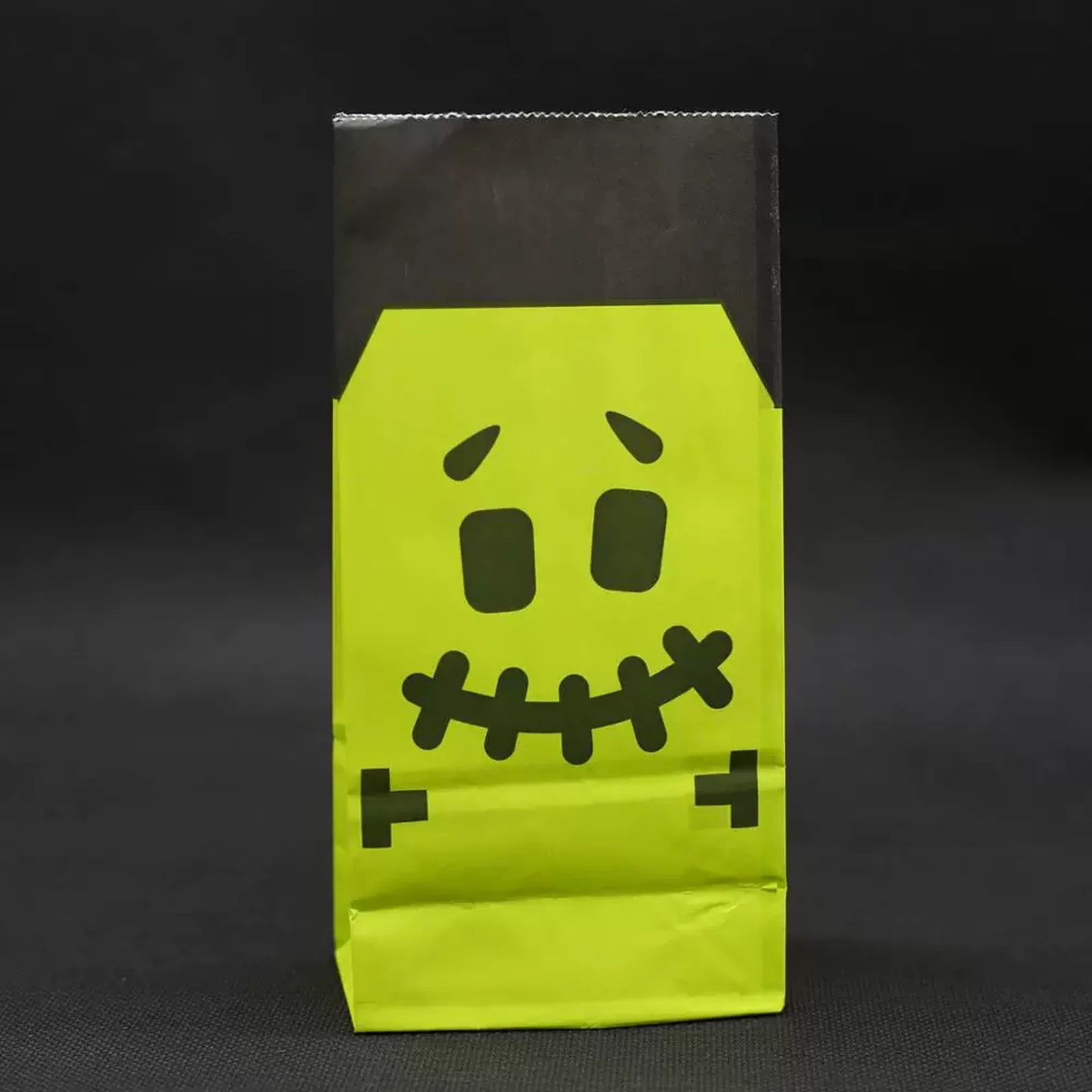 Green monster face fold-over kraft paper Halloween treat bag