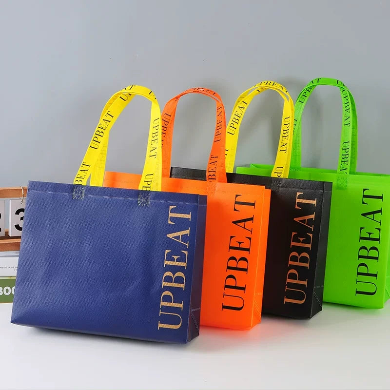 Bright shoulder-style non-woven tote bags in four colors