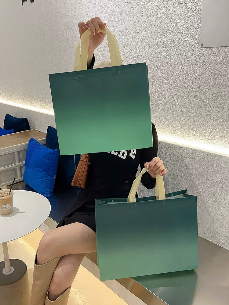 Gradient green non-woven tote bags in two sizes