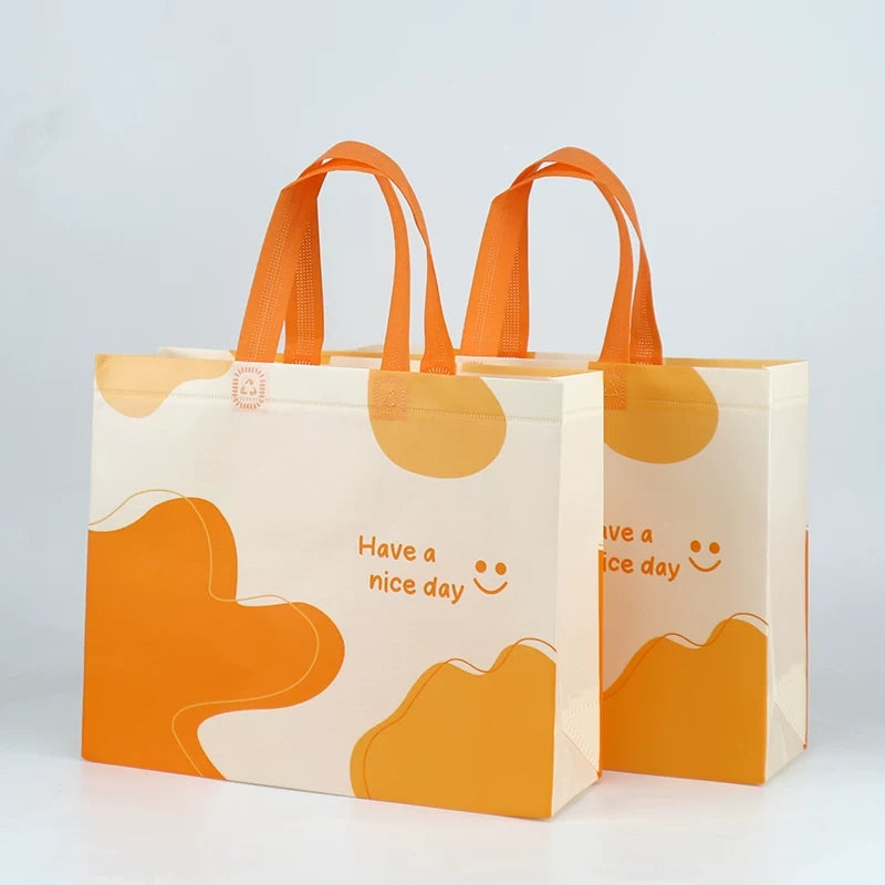 Happy orange non-woven tote bags in multiple sizes