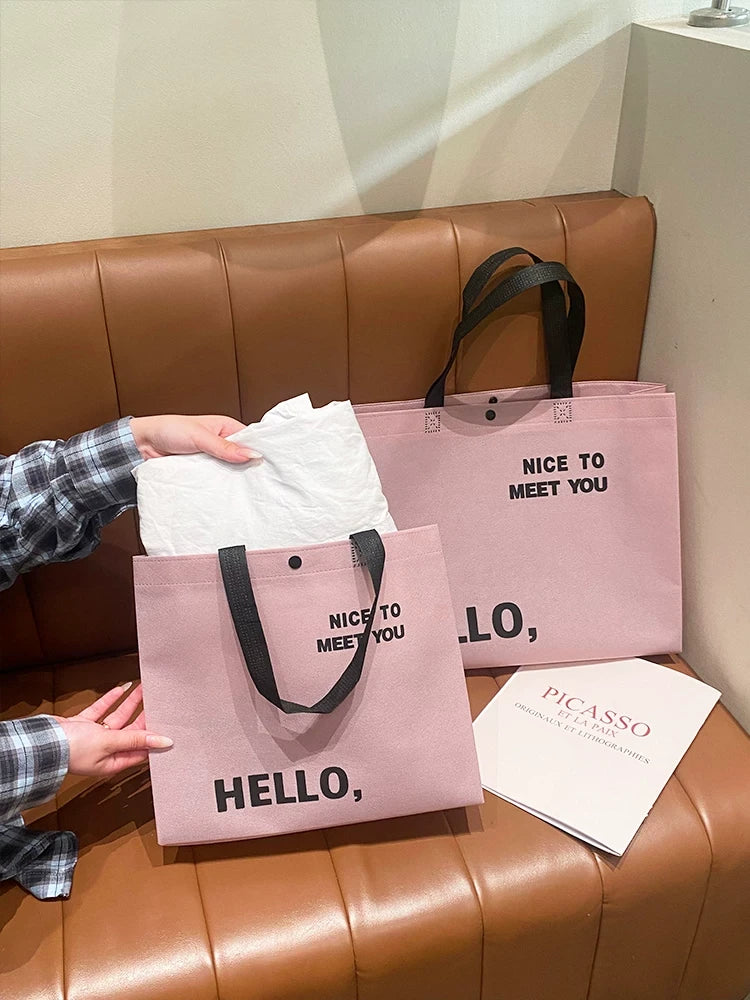 Blush pink non-woven tote bag capacity demonstration