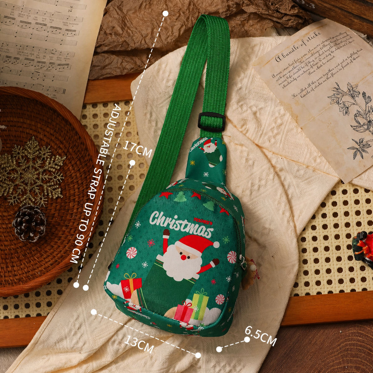 Green knitted Christmas crossbody gift bag with adjustable strap and dimensions