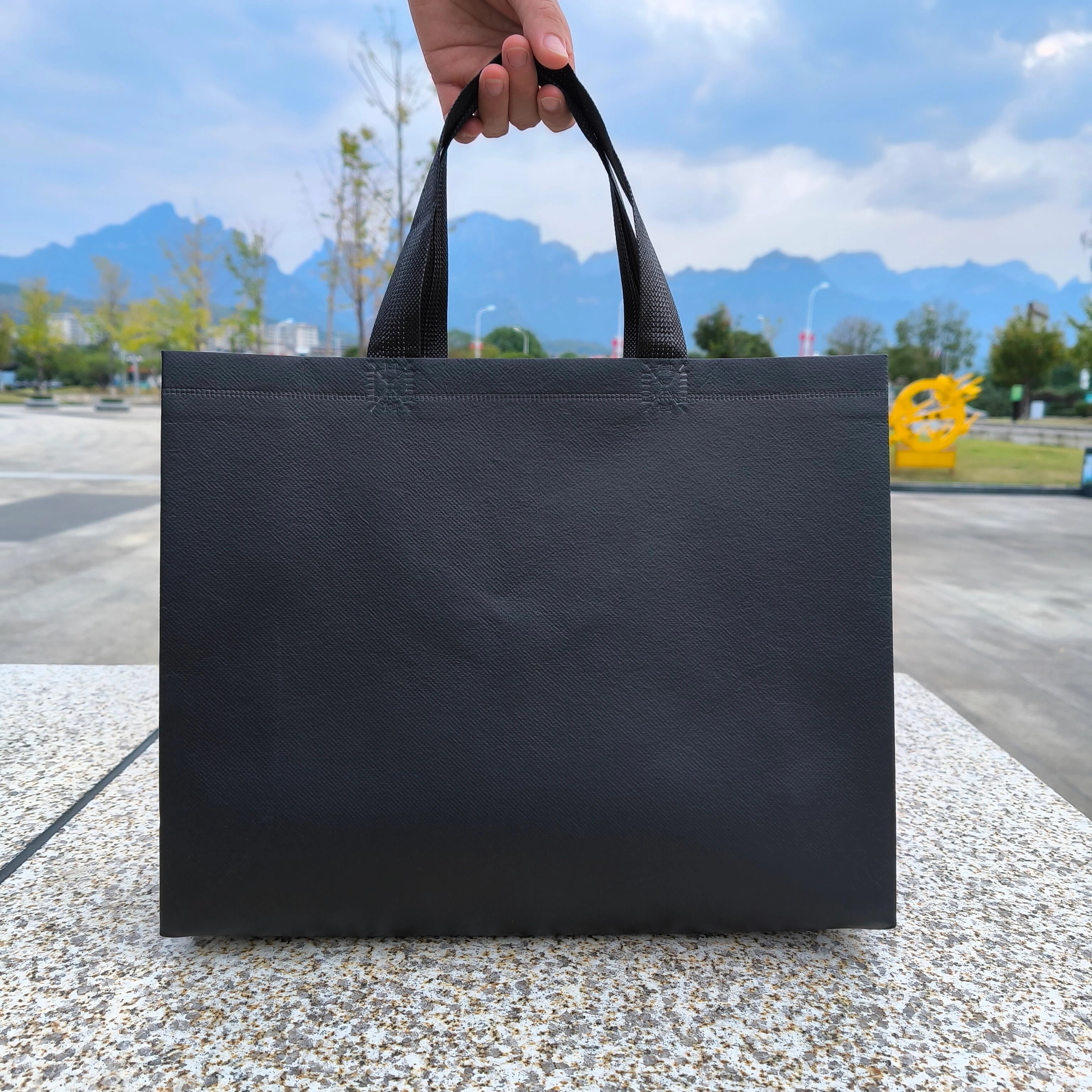Black laminated heavy-duty non-woven tote bags — 18 colors