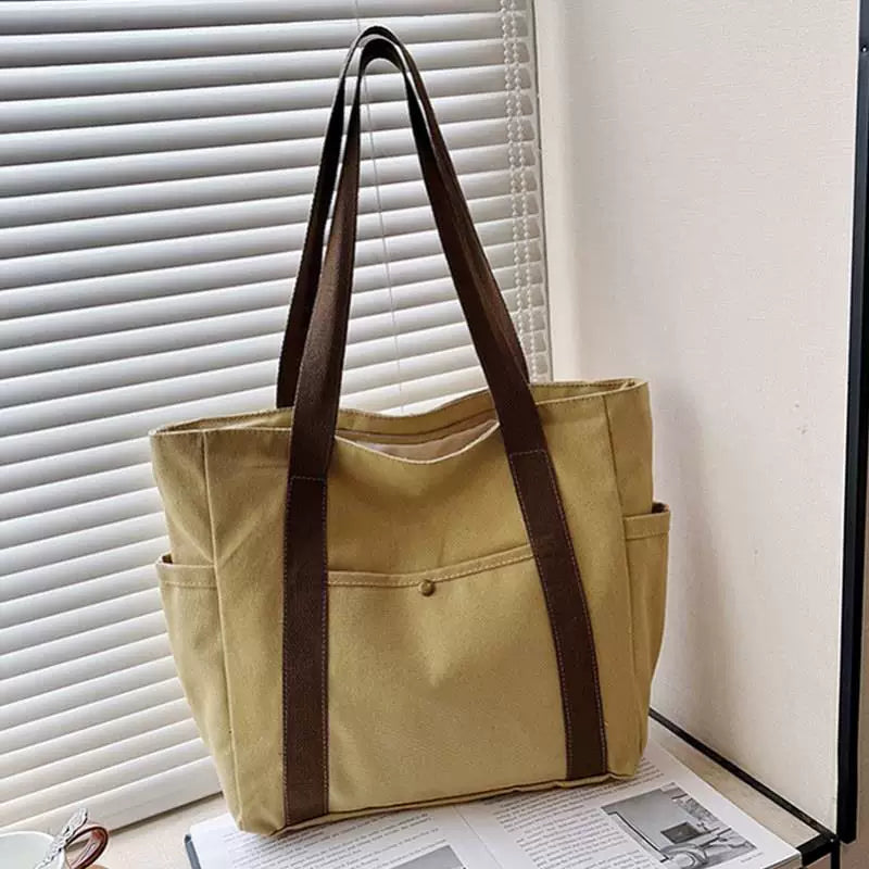Large-capacity khaki canvas tote bag with lining, zipper and dual side pockets