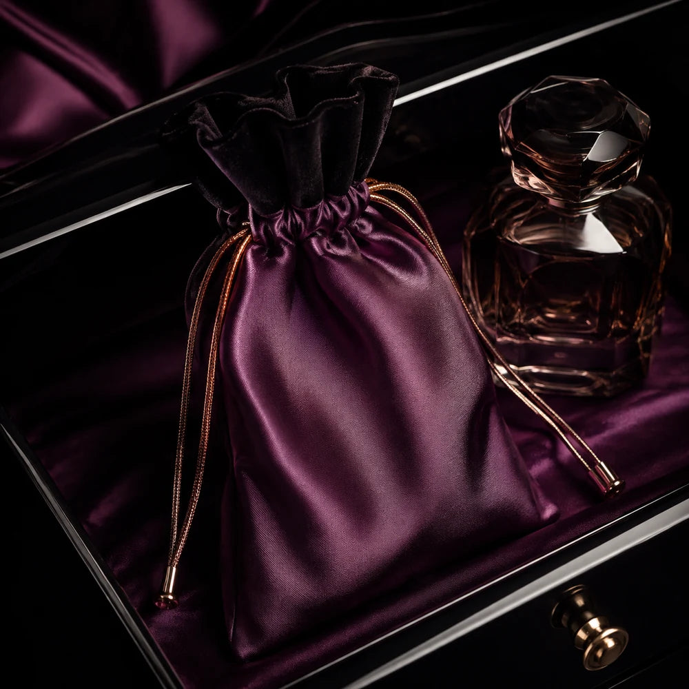 Aubergine satin drawstring pouch with black velvet channel and copper cords