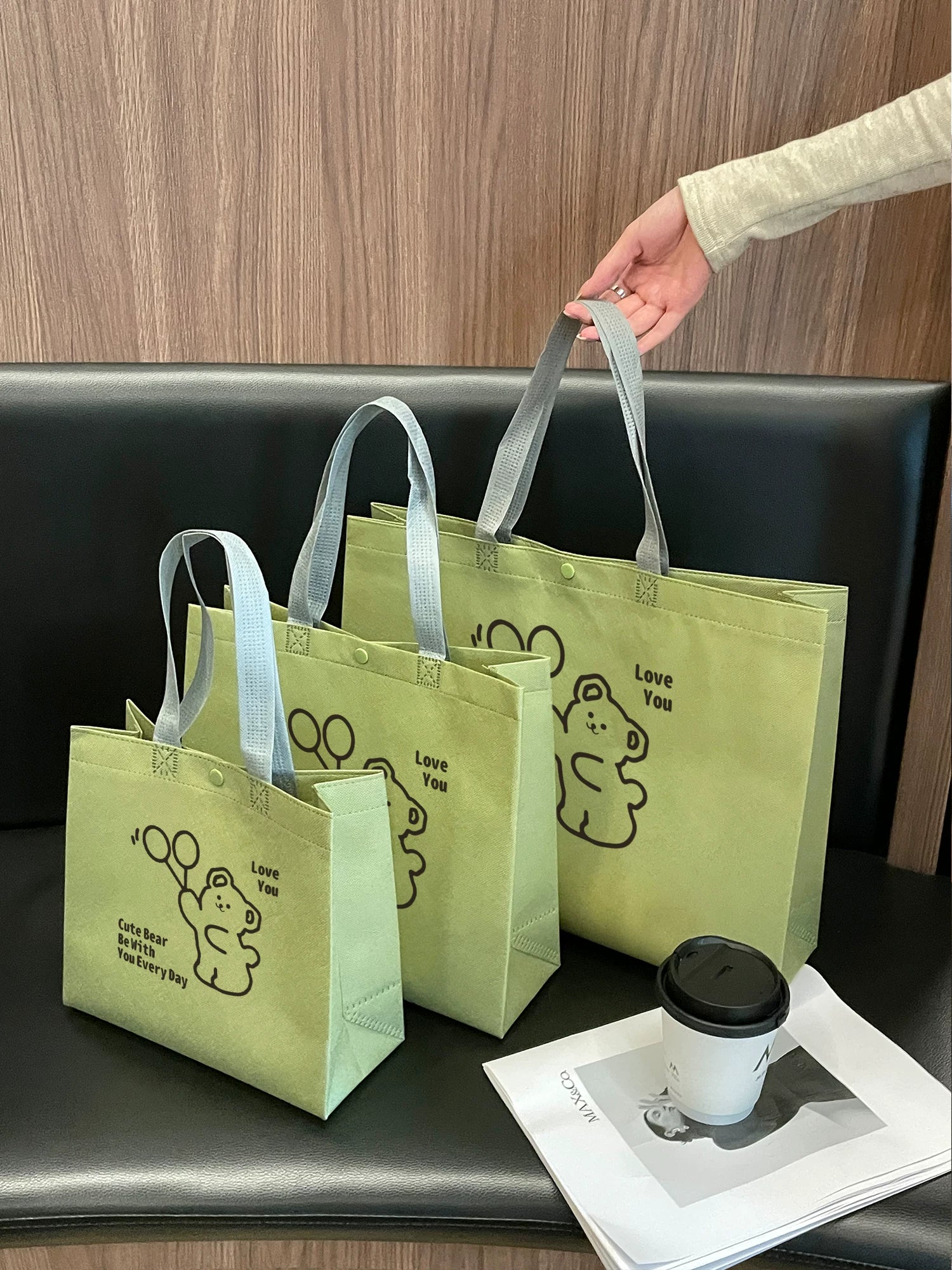 Matcha green non-woven tote bags displayed in four sizes