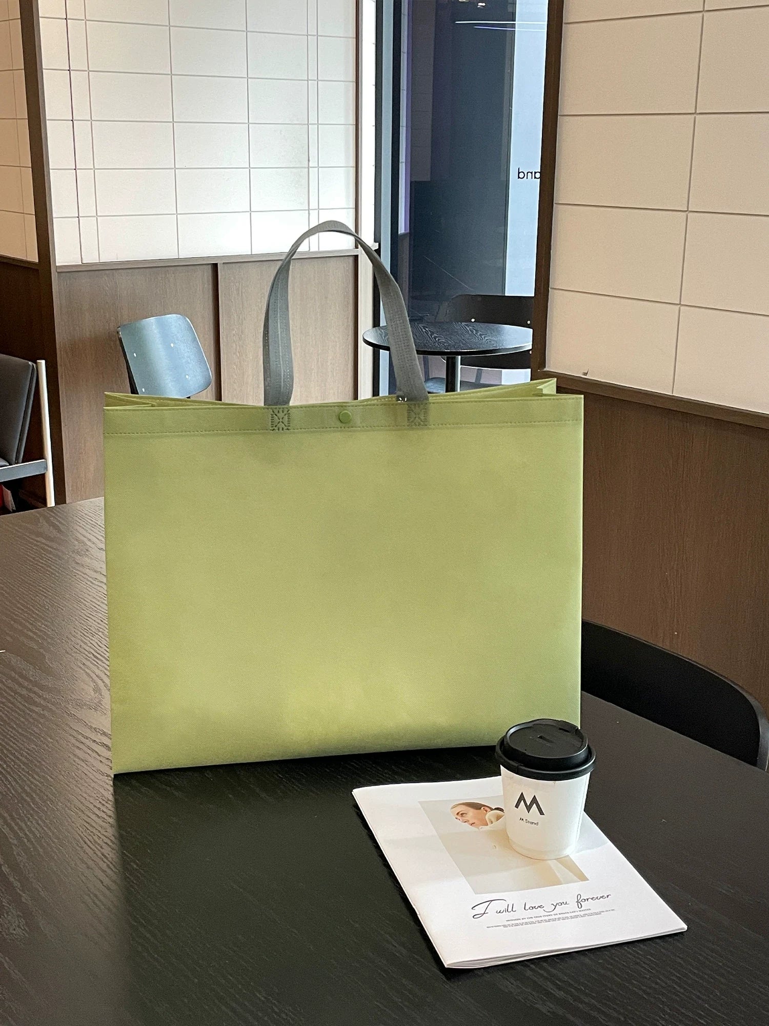 Olive green snap-button non-woven tote bag front view