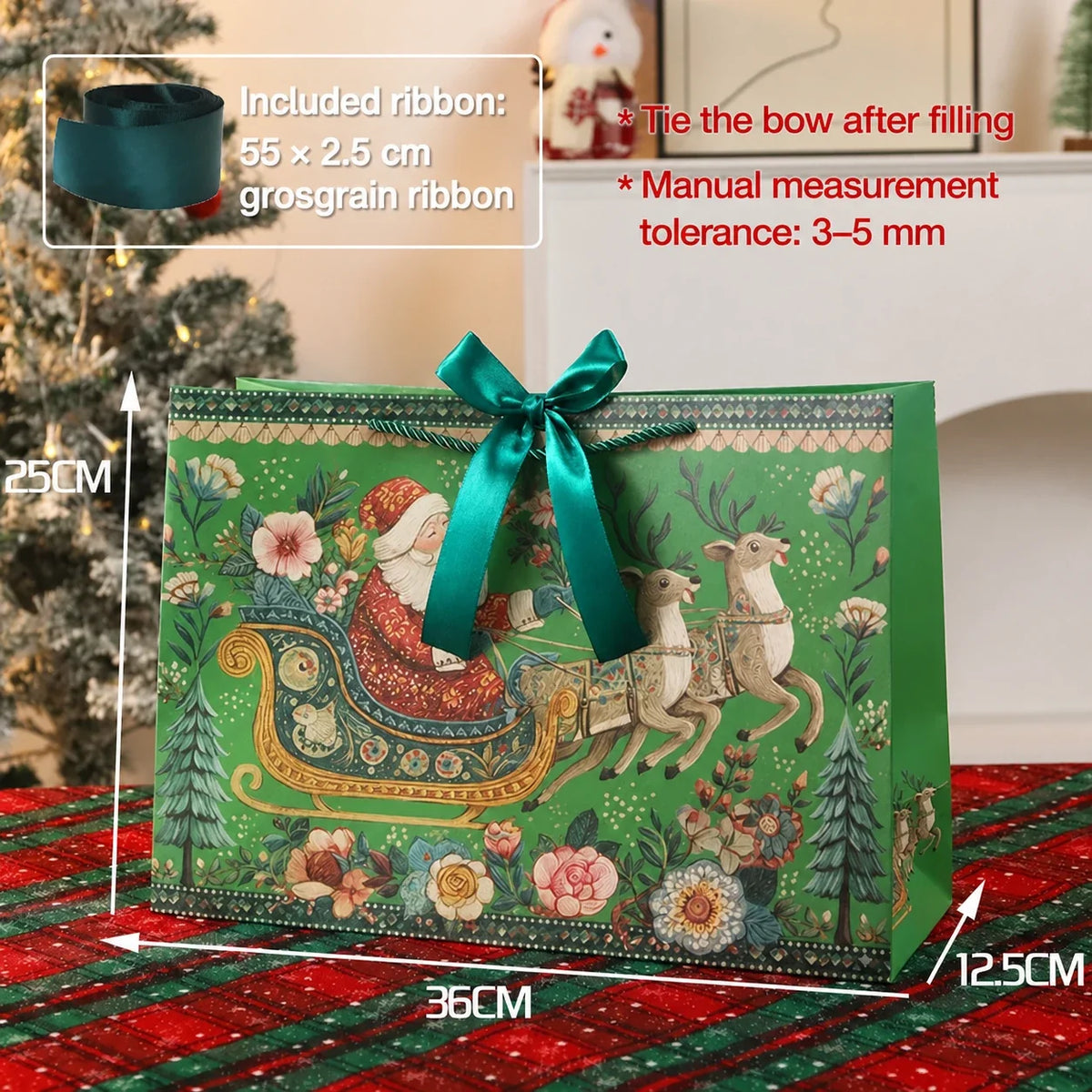 Large green Christmas paper gift bag with Santa sleigh artwork and ribbon closure, 36 by 25 by 12.5 centimeters